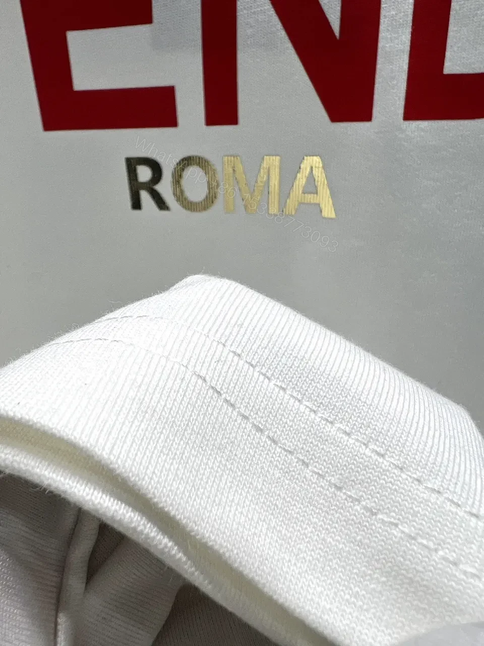 View 6 of White Cotton Tee: Bold Fendi Logo, Minimalist Luxe Crewneck