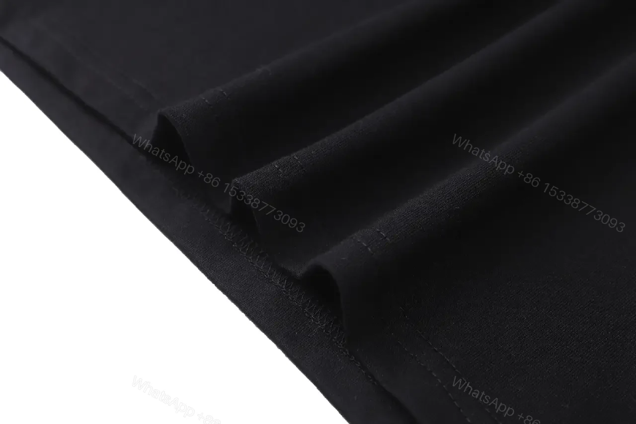 View 9 of Black Cotton Tee with Crest – Subtle Luxe Streetwear Top