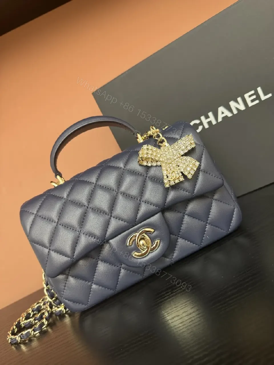 Quilted Leather Mini Bag with Gold Emblem - Compact Glamour — view 1