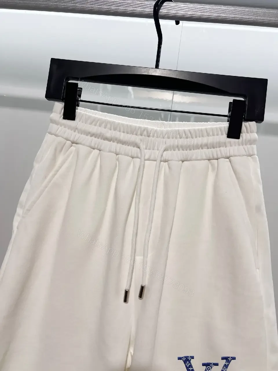 View 11 of Minimalist Luxe Sweatshorts: Premium Relaxed Fit, LV Accent Shorts