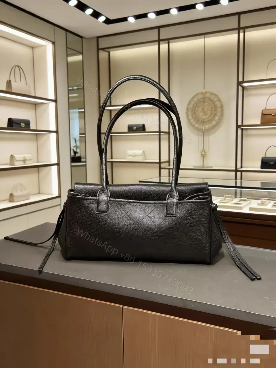 View 2 of Quilted Black Leather Handbag with Gold Hardware Luxury