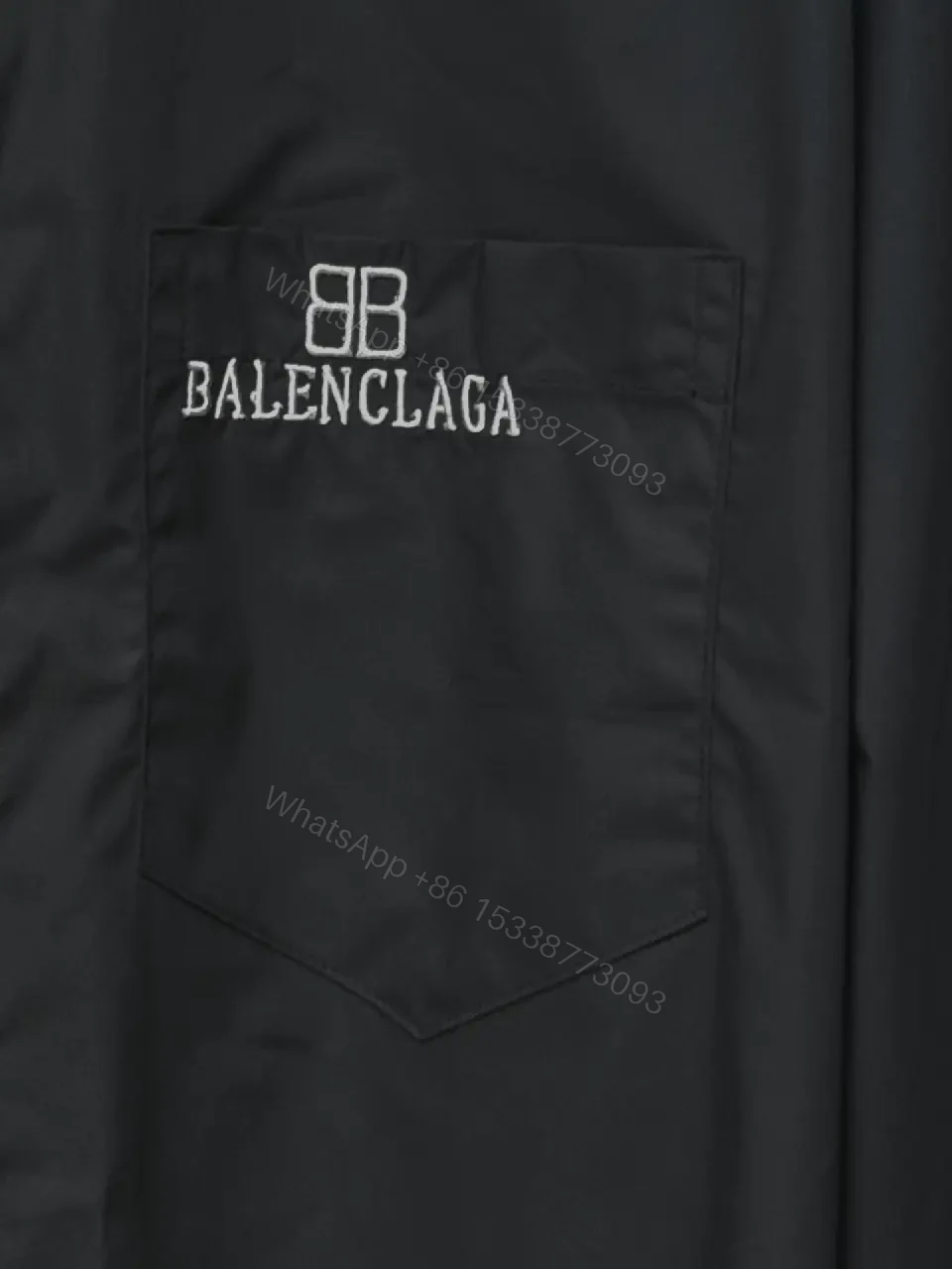 View 11 of Structured Minimalist Button-Front Shirt with Subtle Crest, Black