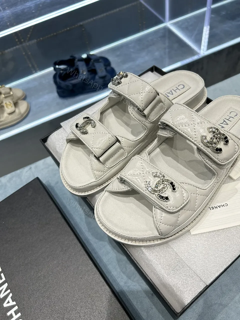 View 3 of Chic White Sandals with Quilted Straps and Logo Hardware