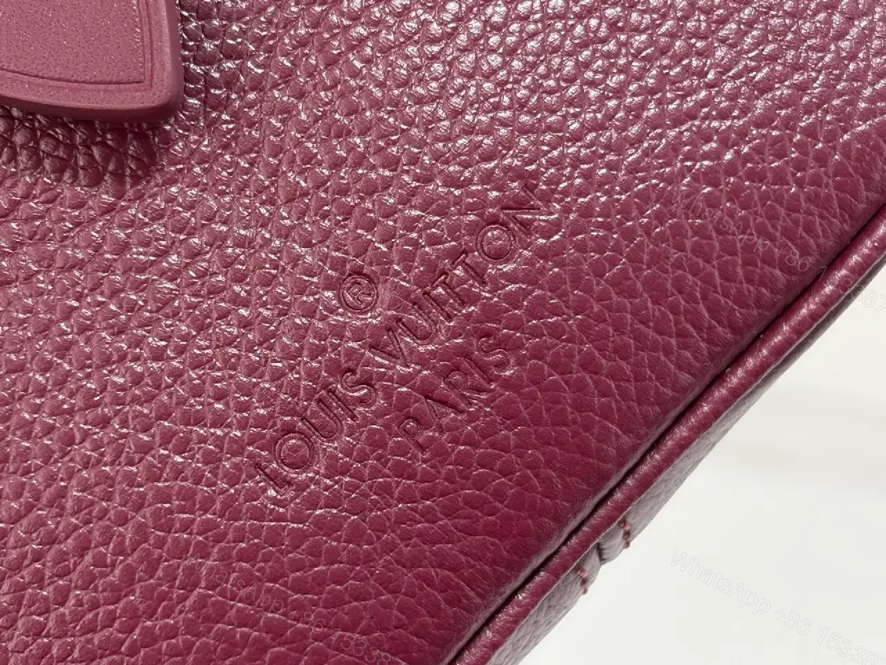 View 6 of Deep Plum Leather Satchel: Structured Top-Handle Bag with Embossed LV Motifs