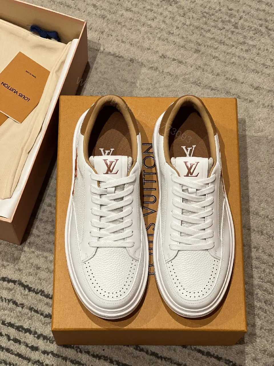 View 2 of White Leather Low-Top Sneakers - Contrasting Tan Accents & LV-Inspired Details
