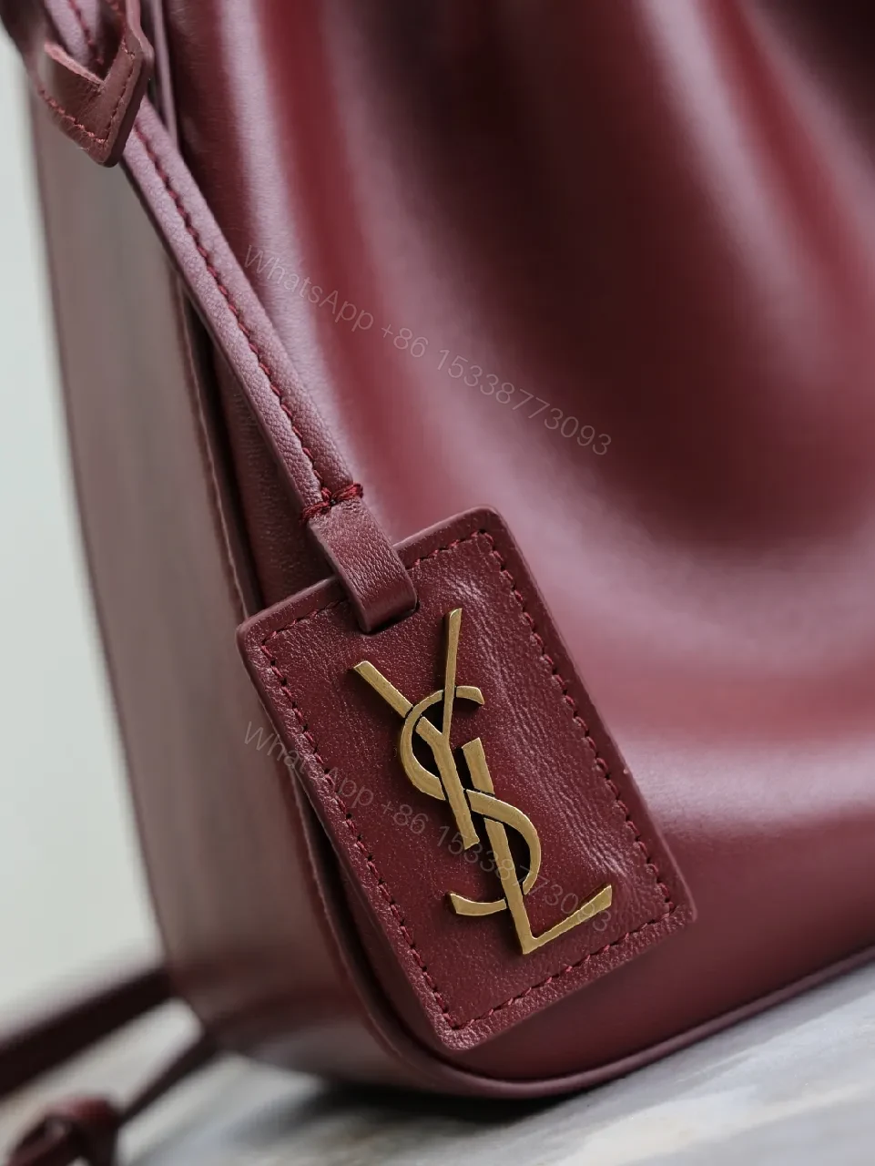 View 9 of Deep Bordeaux Leather Drawstring Bucket Bag—Elevated Everyday Style