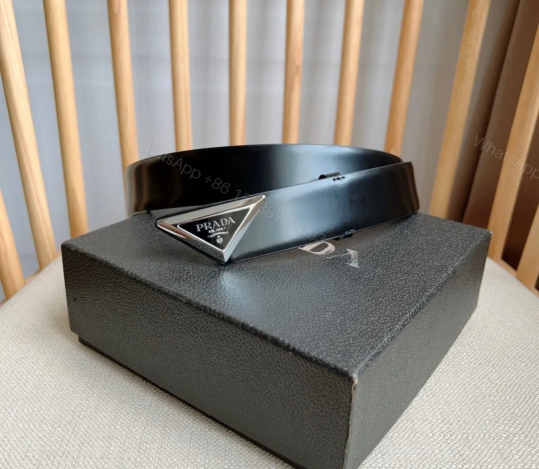 Sleek Black Bonded Leather Belt with Prada Triangle Plaque — view 1