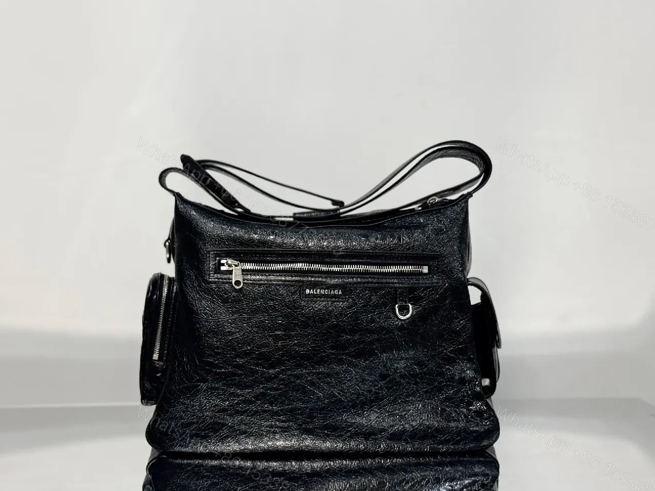 View 4 of Compact Black Leather Messenger Bag: Sleek Crossbody Utility