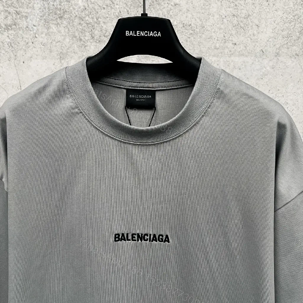 View 6 of Neutral Cotton Oversized Tee: Minimal Logo, Elevated Comfort