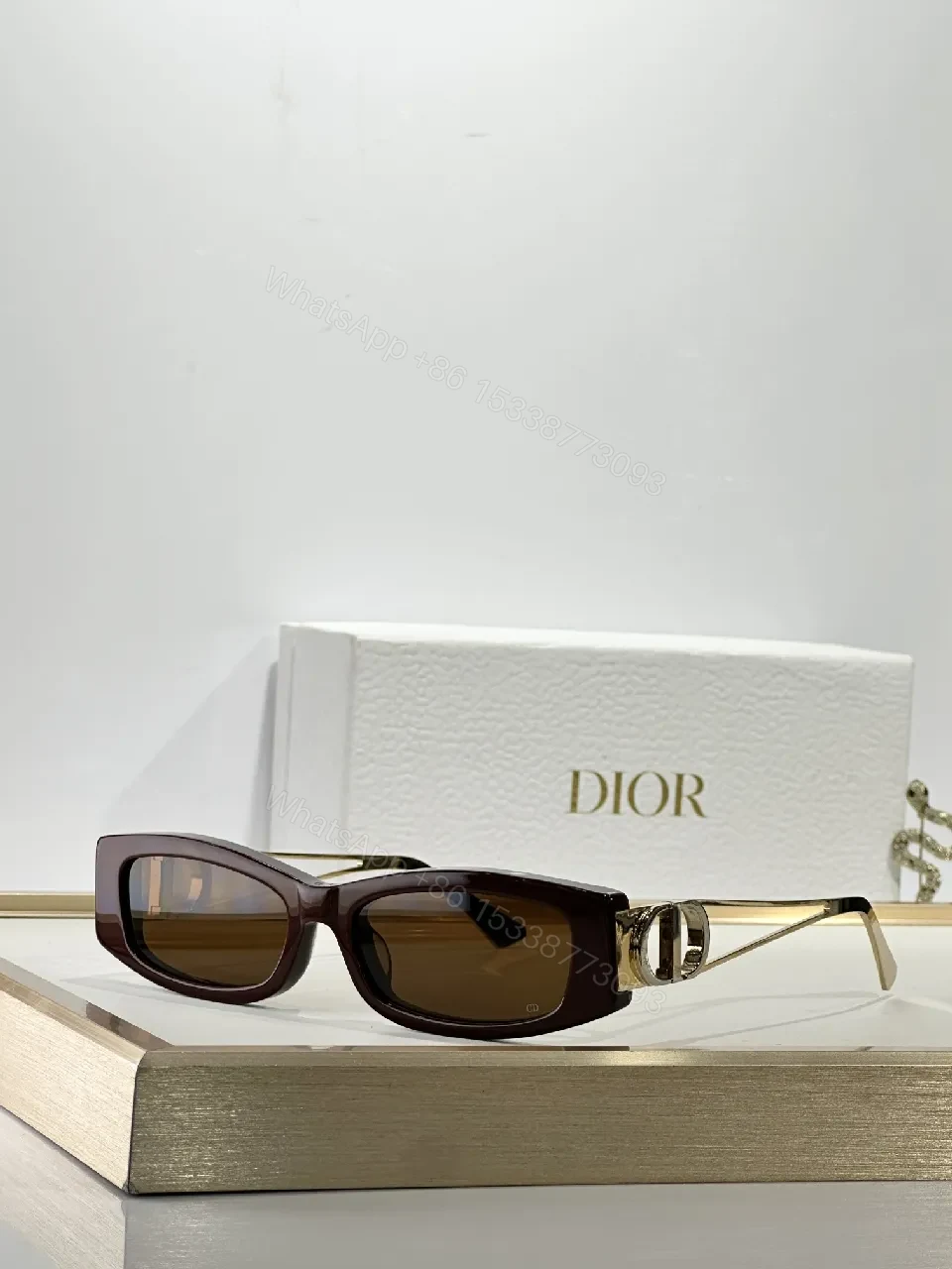 View 2 of White Rectangular Sunglasses with Dior-Gold Accents: Modern Luxury Sideways
