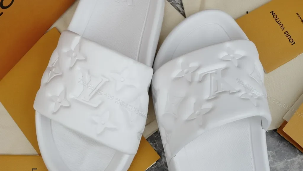 View 2 of Minimalist White Slides with LV Embellishment â€“ Luxe Comfort Slide