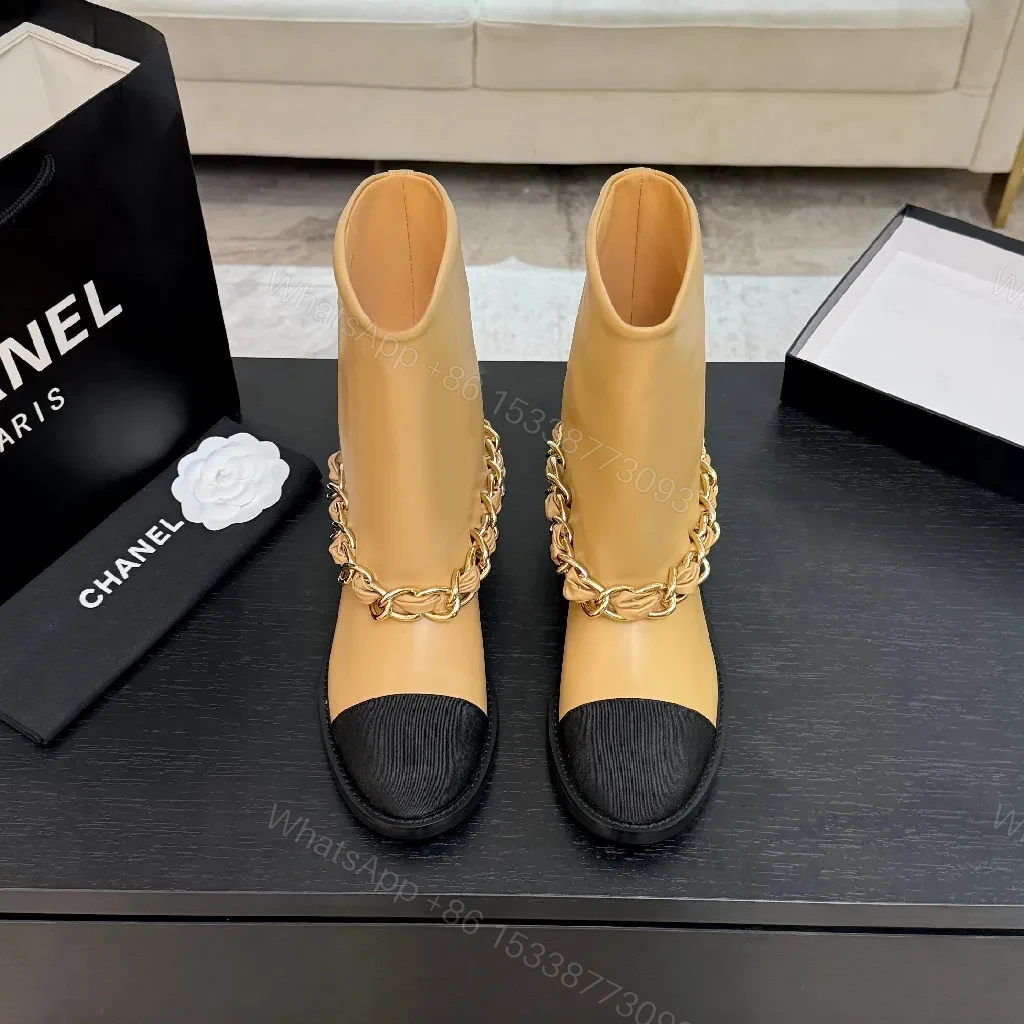 View 2 of Chic Tan Leather Boots with Black Toe Cap and Chain Detail