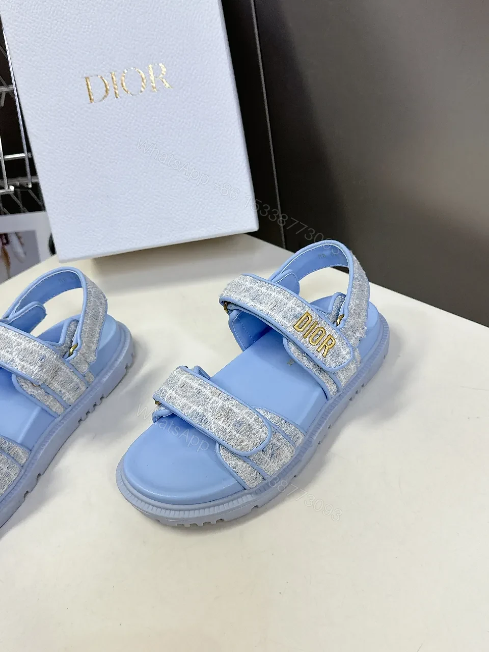 View 7 of Soft-Gleam Crest Sandals: Light-Blue Textured Straps, Minimal Logo