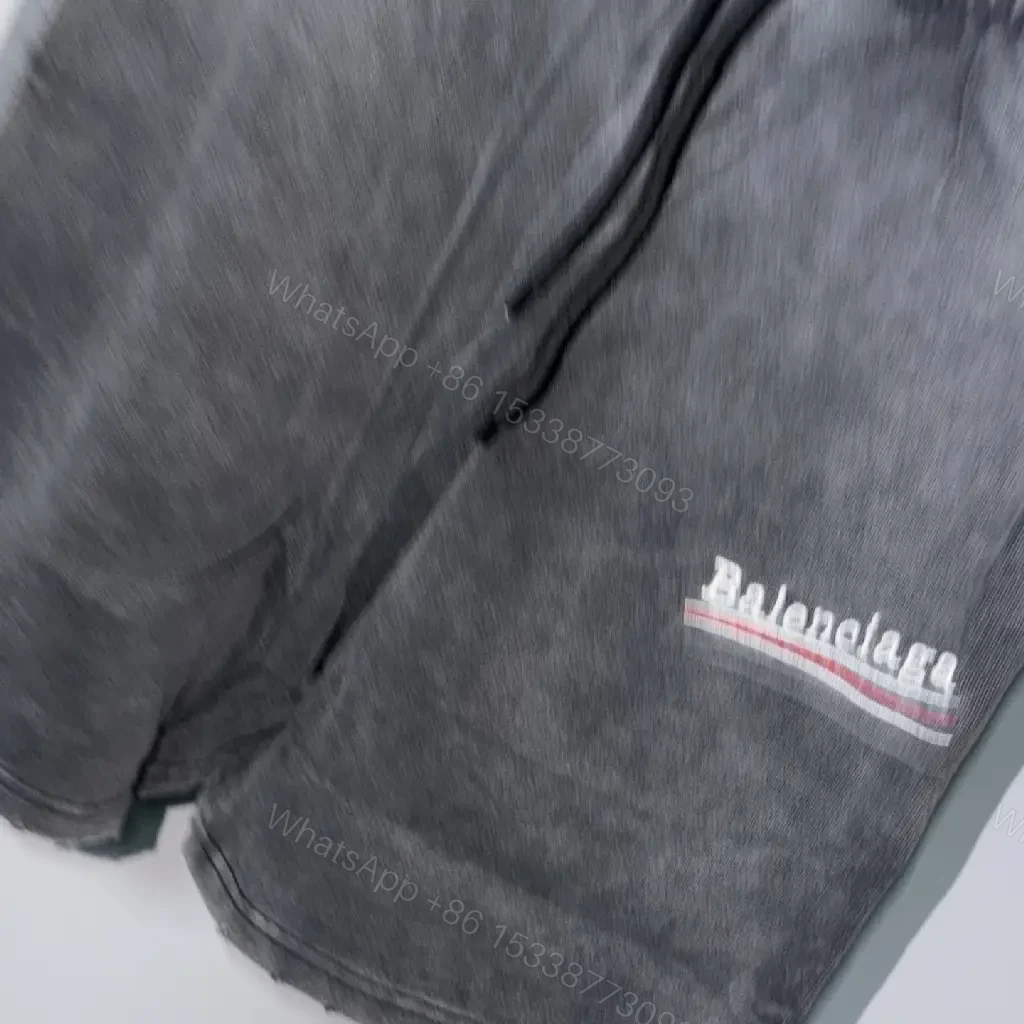 View 2 of Black Denim Shorts with Logo Accent, Balenciaga Style, Key Feature: Drawstring Washable Design