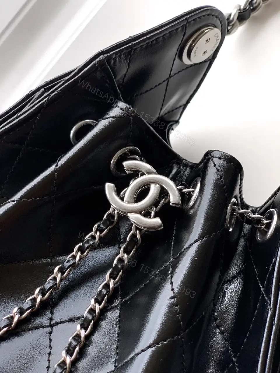 View 6 of Quilted Black Leather Bag with Chain Strap—Compact Elegance