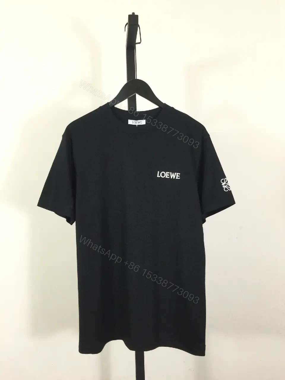 View 2 of Minimalist Black Tee: Subtle Branding, Everyday Luxury Tee