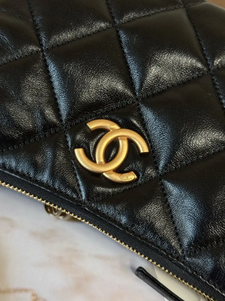 View 4 of Quilted Crossbody with Gold Emblem: Compact Luxury Bag