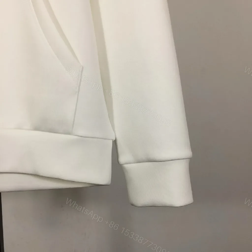 View 7 of Minimalist Off-White Hoodie with Subtle Logo Design