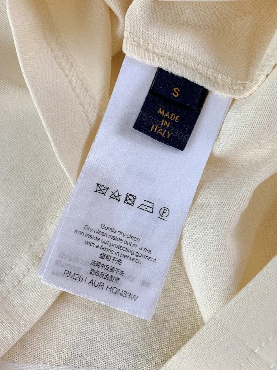 View 4 of Minimalist Off-White Cotton Tee with Signature L.V.M. Accent