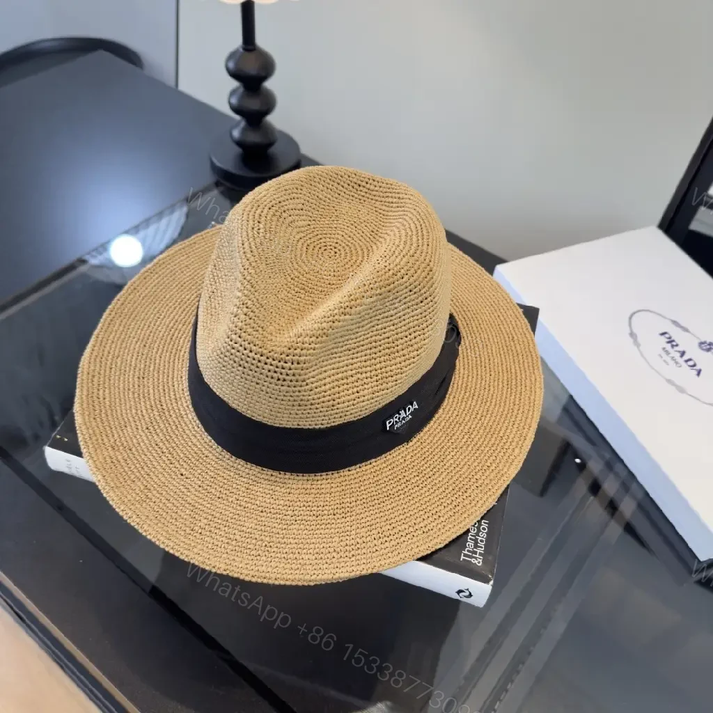 View 4 of Light Tan Straw Wide-Brimmed Floppy Hat with Black Ribbon Band