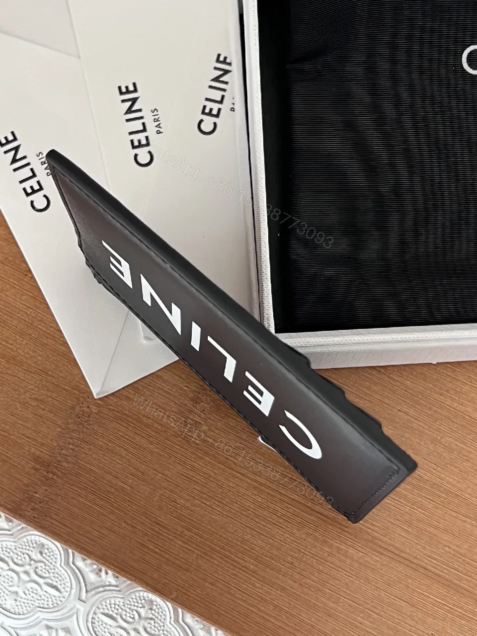 View 2 of Minimalist Black Cardholder: Bold CELINE Print, Compact Luxury