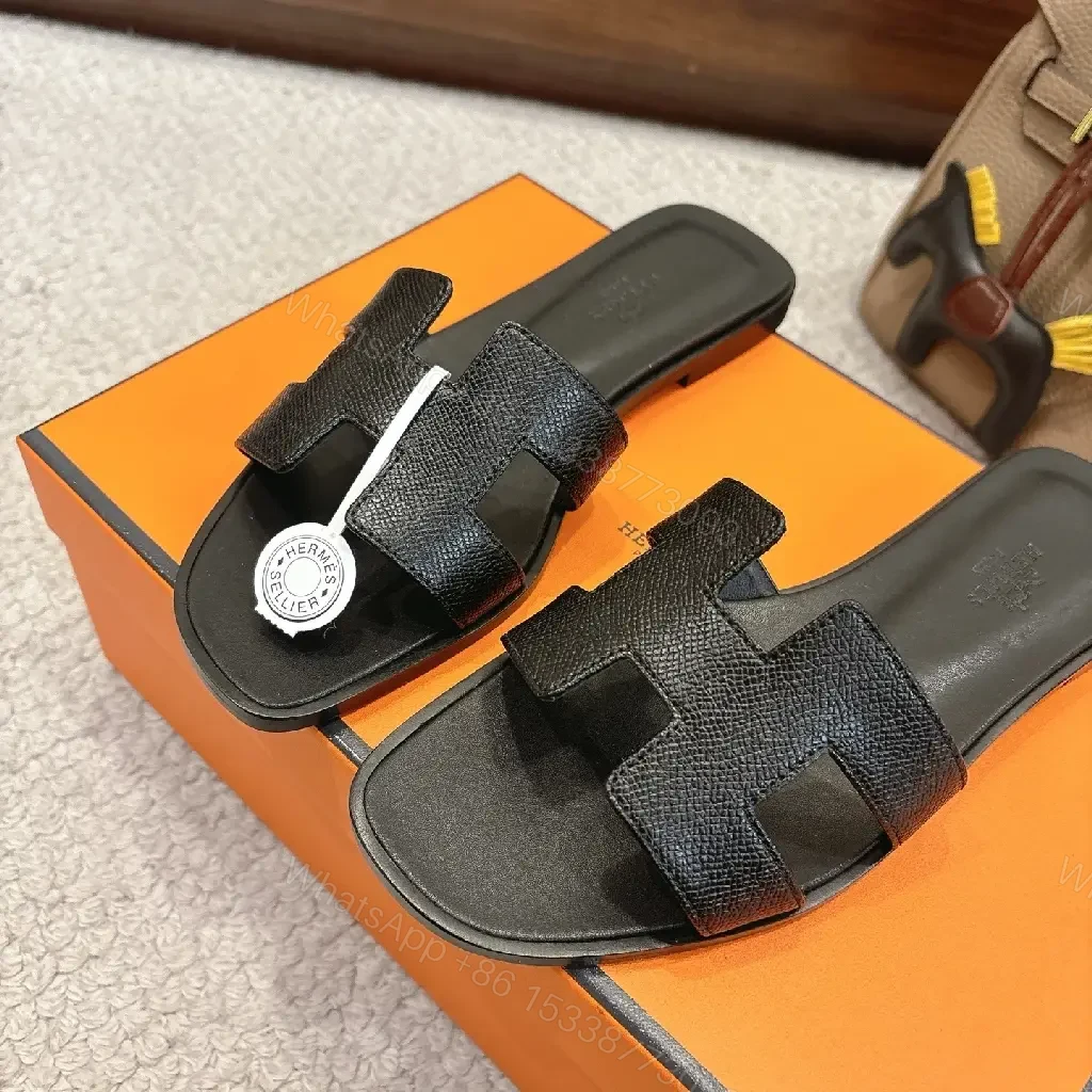 View 7 of Black Leather Minimalist Slides with Signature Cross‐Band