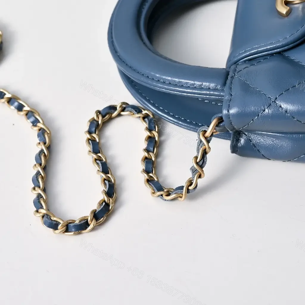 View 6 of Compact Blue Quilted Satchel with Gold Clasp Bag
