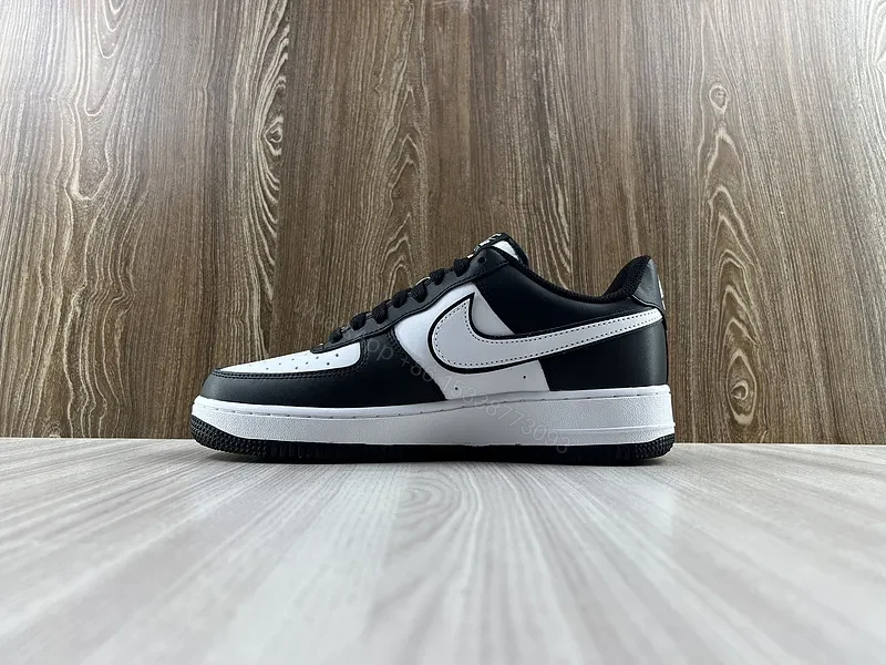View 2 of Black Leather Low-Top Sneakers with Signature Swoosh