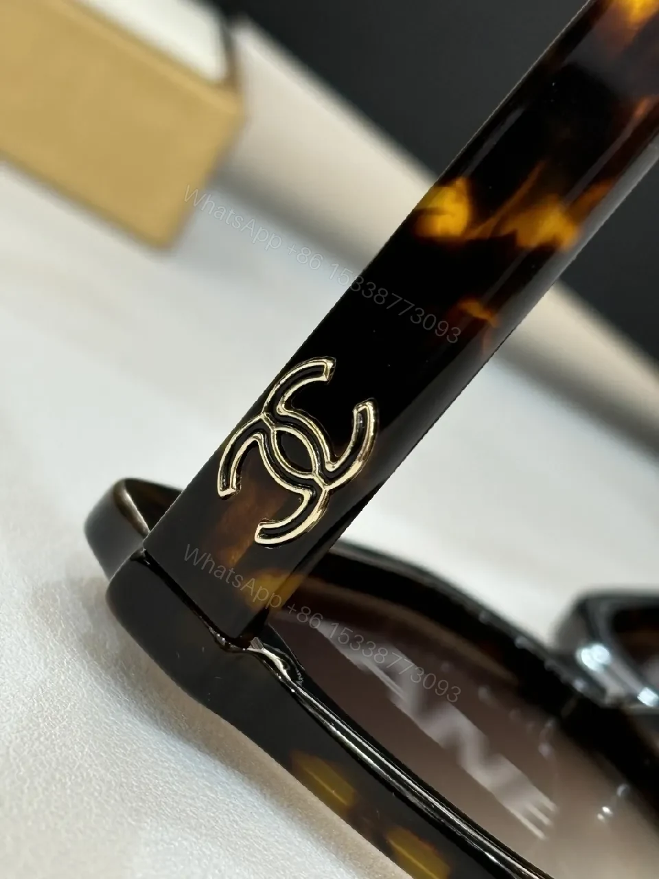 View 3 of Boldly Sophisticated Sunglasses: Oversized Tortoise Frames with Chanel Detailing