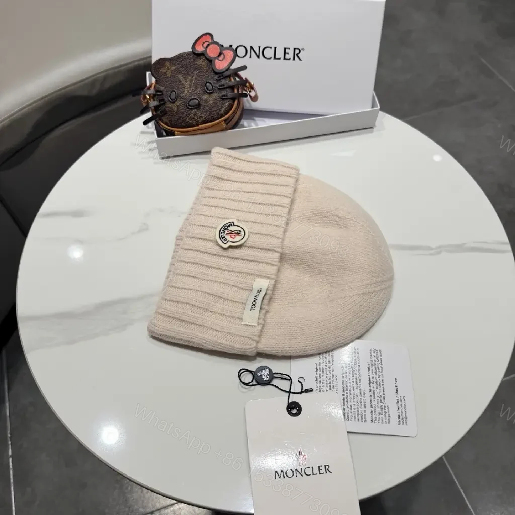 View 4 of Beige Wool Knit Beanie, Subtle Crest, Everyday Luxury