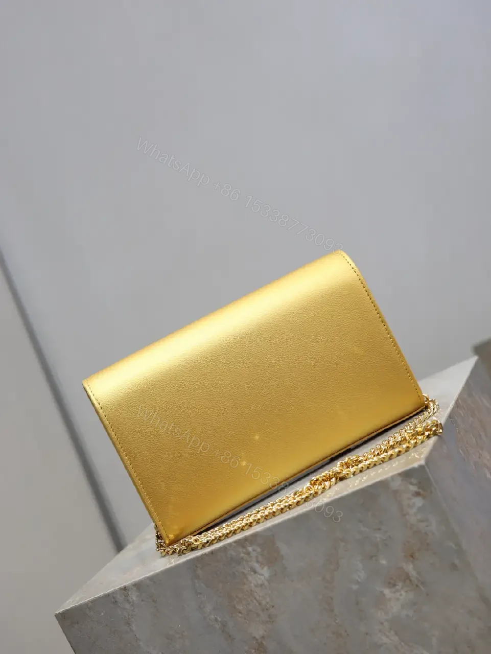 View 4 of Gold-Tone Leather Clutch Wallet with YSL Hardware