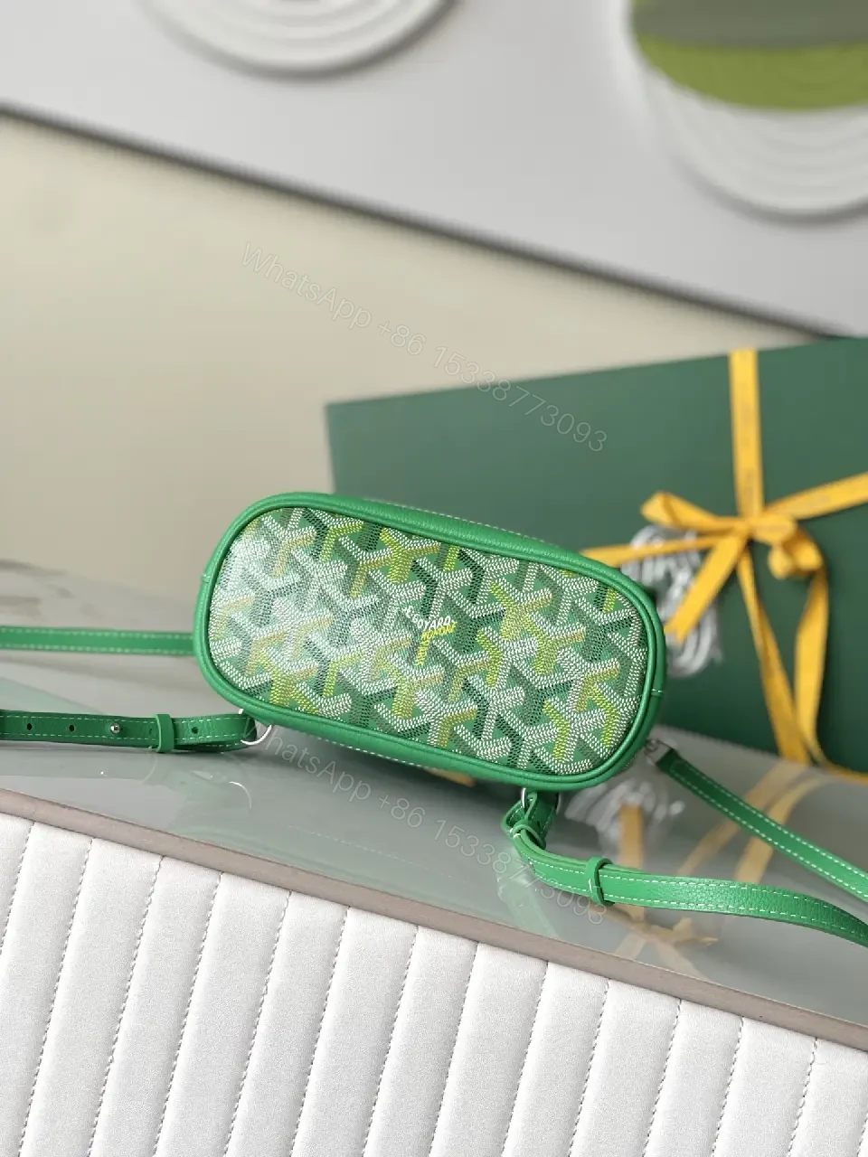 View 9 of green leather mini backpack with monogram pattern and luxury green trim for everyday use