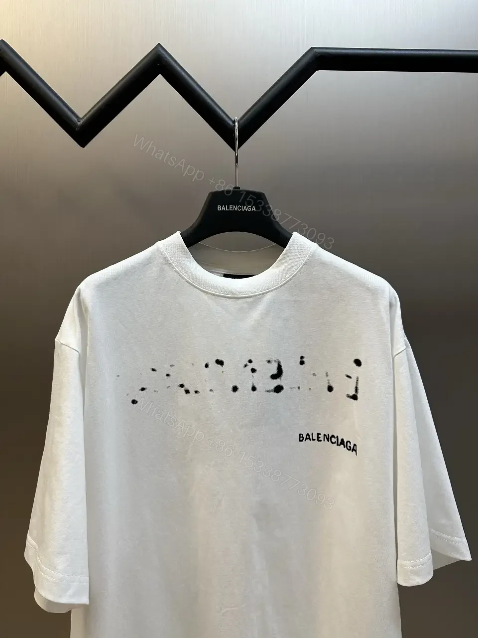 View 9 of Oversized Graphic Tee with Subtle Distress and Logo – Premium Cotton