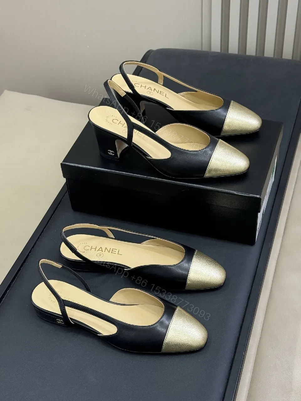 Elegant Slingback Pumps: Black Leather with Metallic Cap Toe — view 1