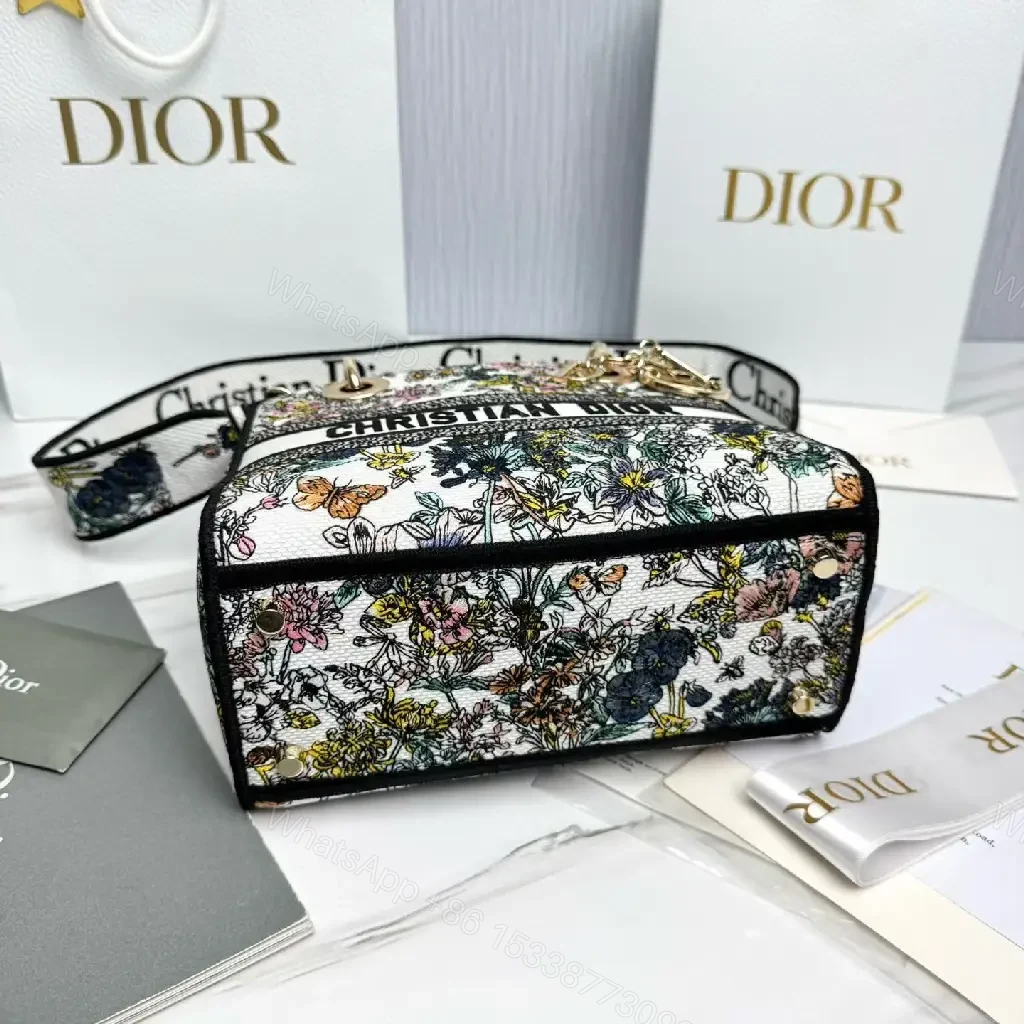 View 7 of Floral Canvas Luxe Bag with Logo Detailing Handbag