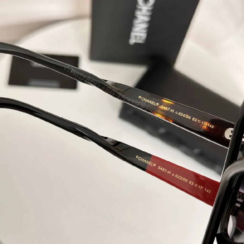 View 3 of Glossy Black Cat-Eye Sunglasses with Gold Accents & Red Temples