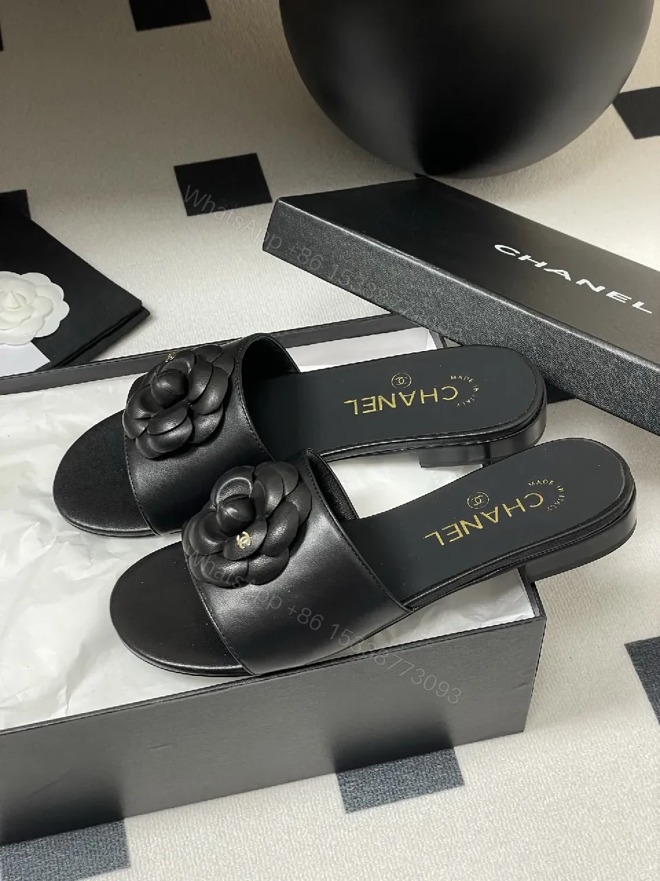 View 3 of Effortless Black Leather Slide with Camellia Detail
