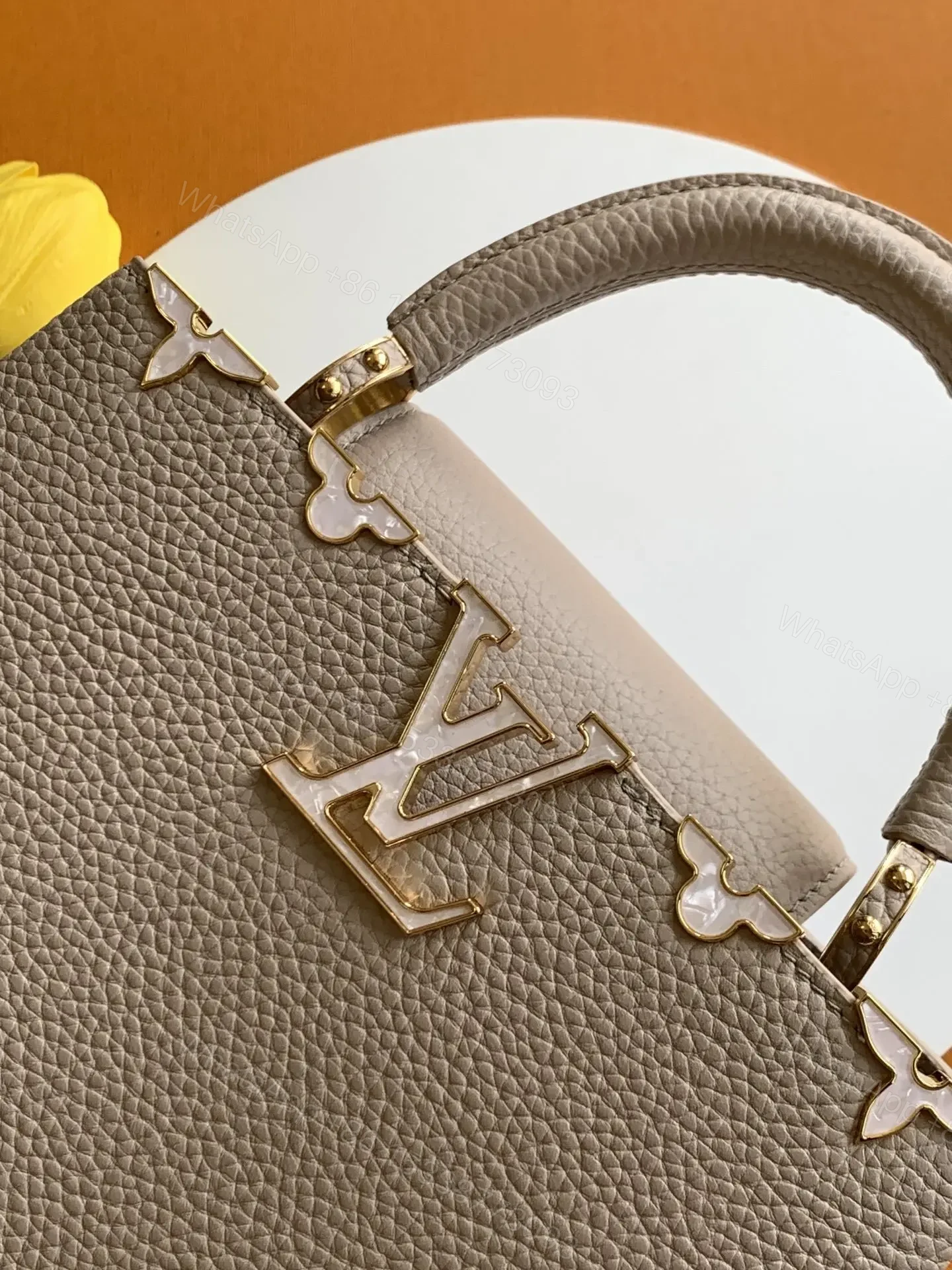 View 6 of Louis Vuitton Capucines handbag in a beige