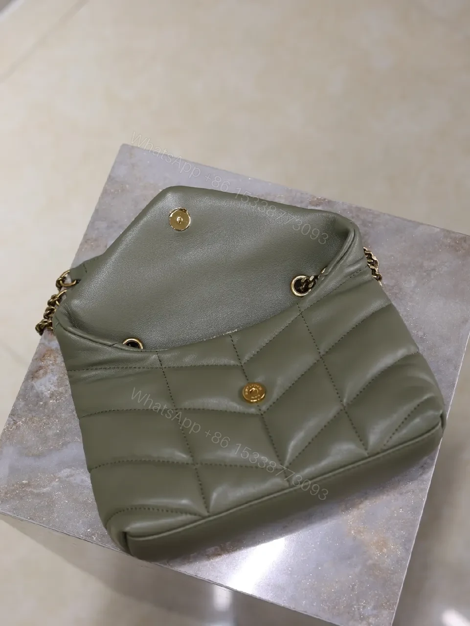 View 6 of Textured Olive Quilted Shoulder Bag with Gold Emblem, Compact Elegant Style