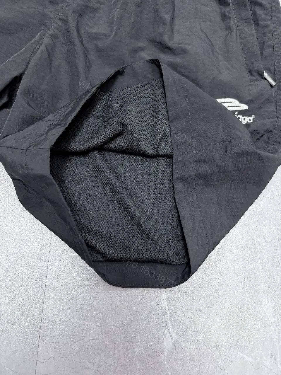 View 4 of Black Nylon Tech Shorts Lightweight Balenciaga Drawstring Closure Short Pants