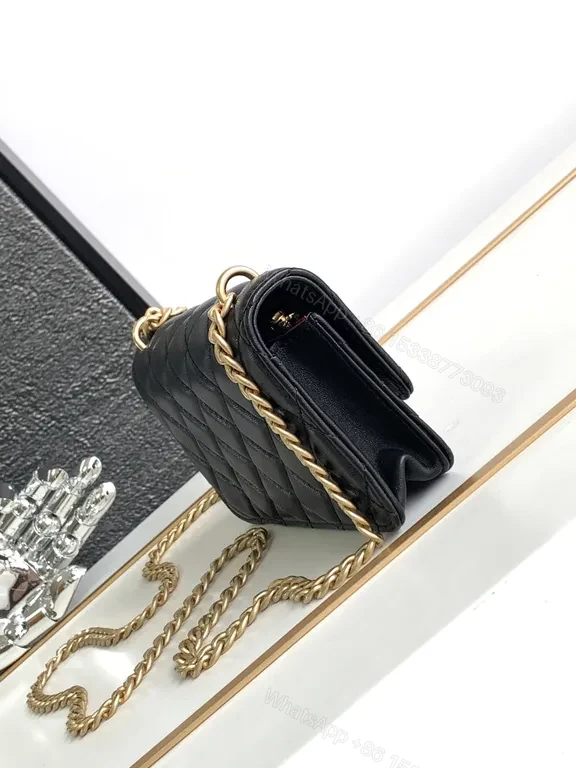 View 8 of Mini Quilted Black Chain Bag with Gold Logo â€” Luxury Silhouette