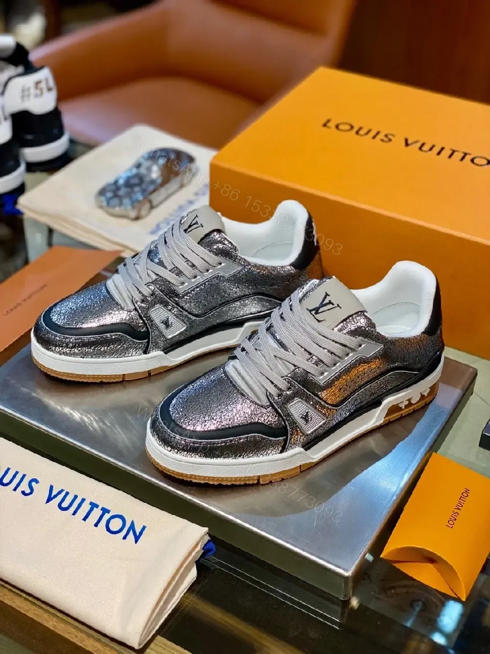 Metallic Leather High-Top Sneakers with Subtle LV Detailing — view 1