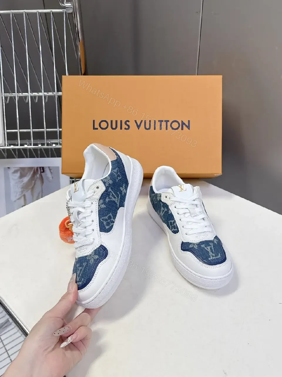View 8 of Denim-Accent Luxury Sneakers with LV Flair