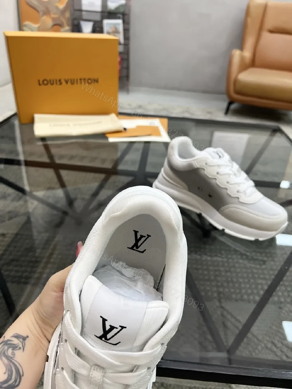 View 4 of White Leather Minimalist Luxe Sneakers with LV Detail