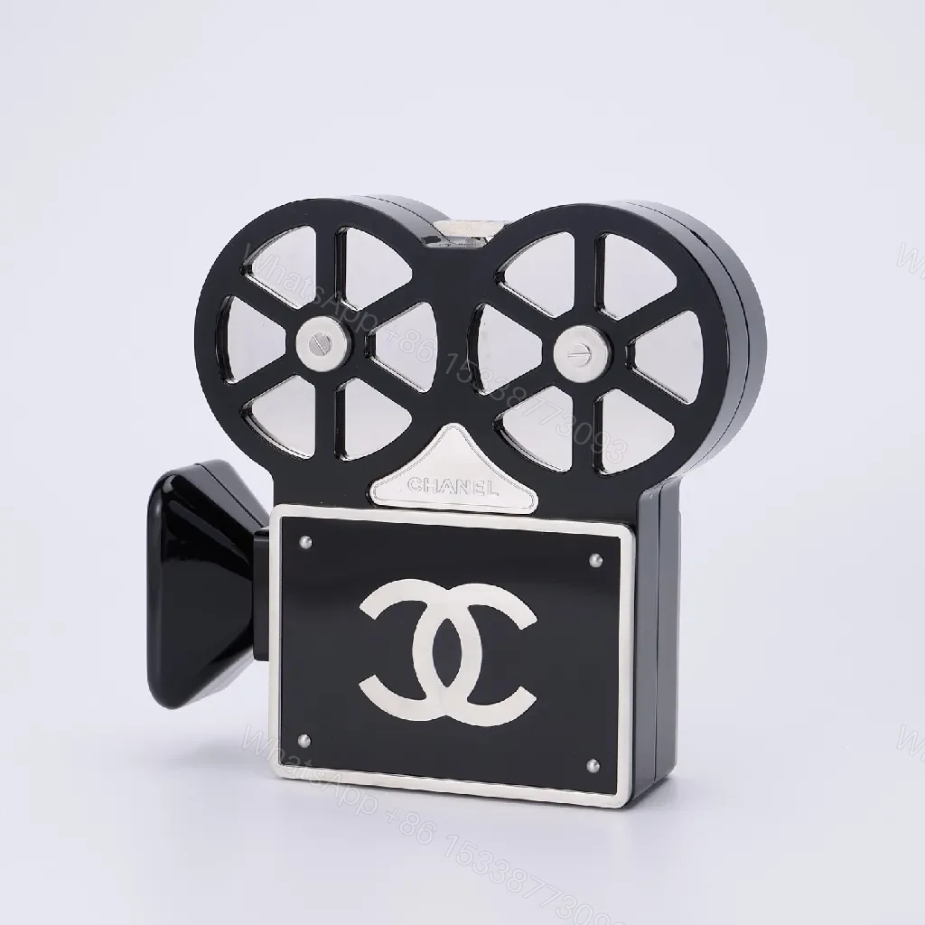 View 3 of Compact Reel-Clutch: Lux Gloss Hardware with Architectural Silhouette