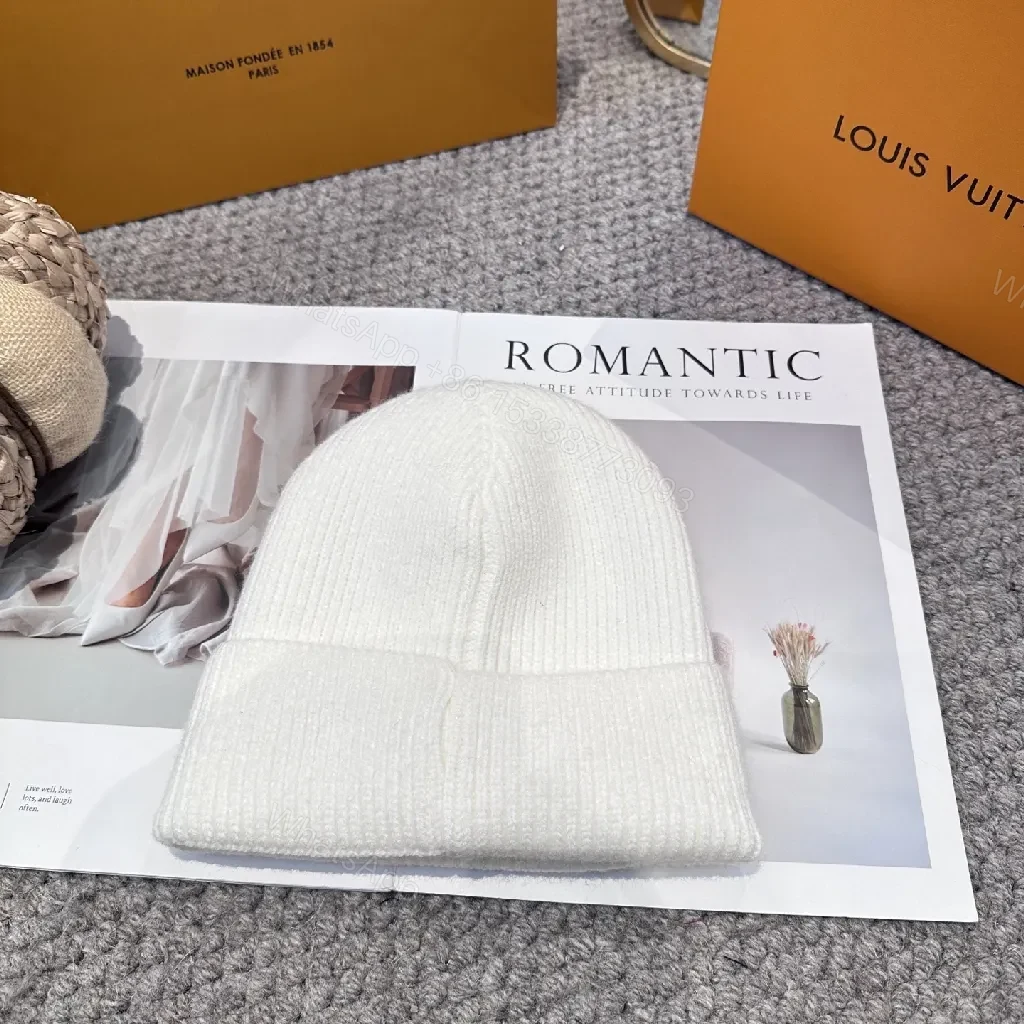 View 4 of White Knit Beanie – Luxe Logo Detail, All-Season Comfort
