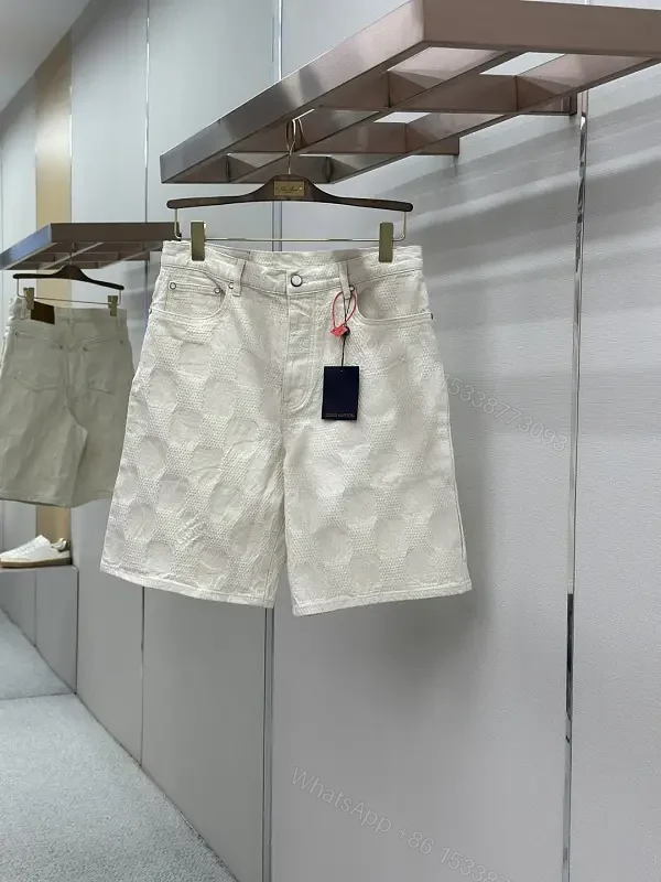 Beige textured cotton-blend shorts with monogram-inspired print for everyday luxury — view 1