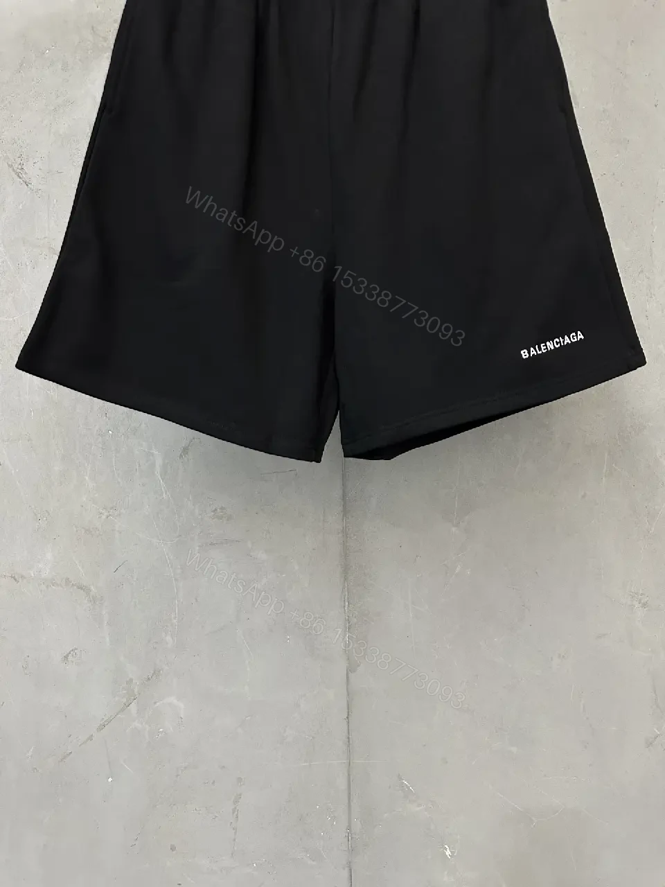 View 3 of black nylon shorts with logo motif for luxury everyday wear