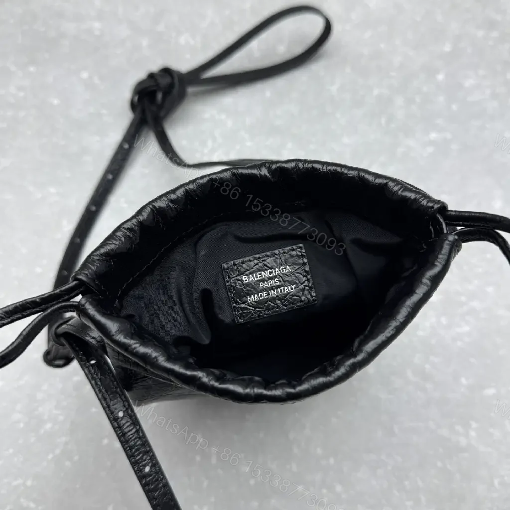 View 11 of Black Leather Drawstring Crossbody Bag - Minimalist Luxe Compact Carry