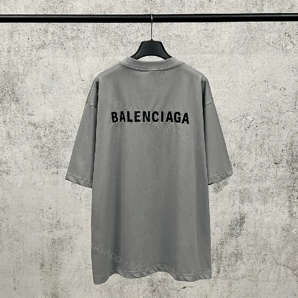 View 9 of Neutral Cotton Oversized Tee: Minimal Logo, Elevated Comfort